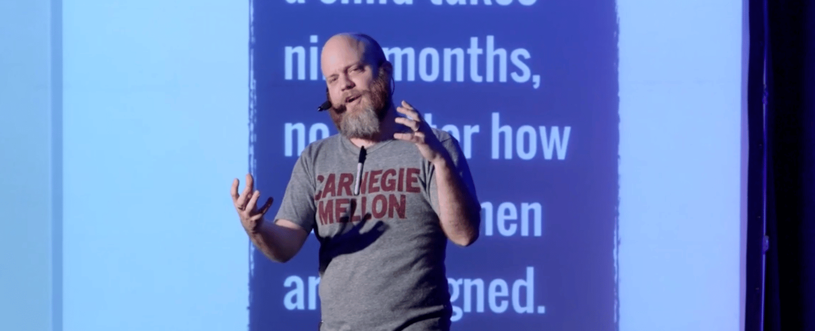 Jabe Bloom on a stage while giving a talk